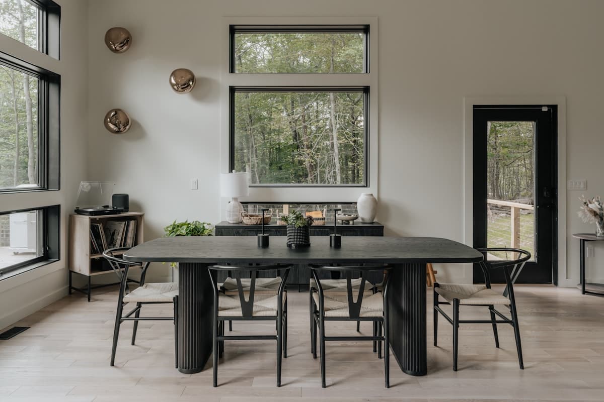 Original dining room before the coastal AI redesign — generic furniture, dim warm lighting